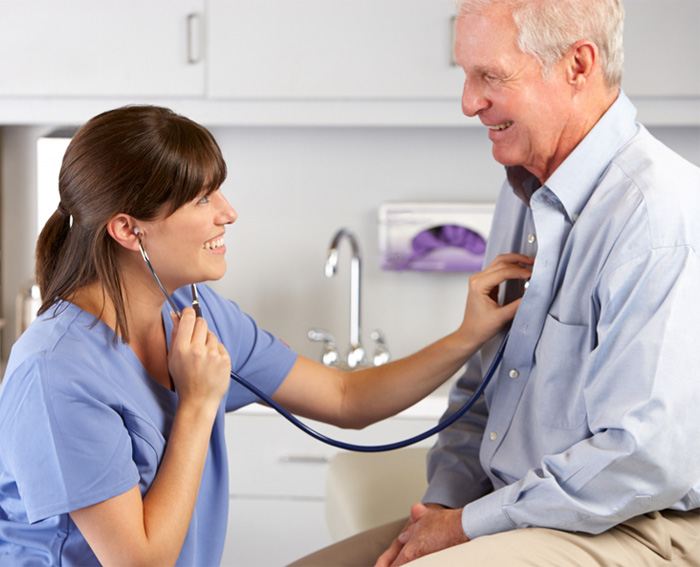 Doctor monitors patient using stethoscope