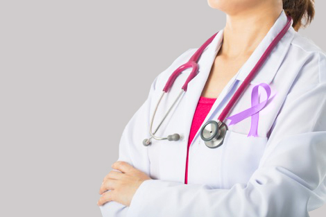 Doctor wearing awareness ribbon on lab coat