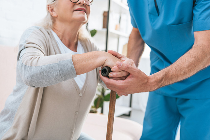 Nurse helping elderly patient