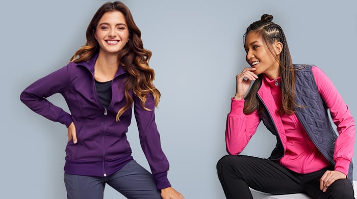 Nurses wearing brightly colored scrub jackets