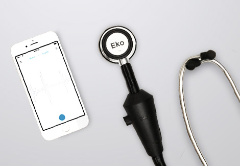 Eko digital stethoscope with phone against a gray background