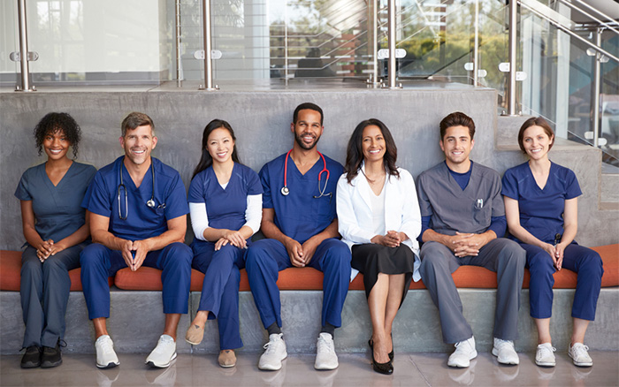 group of healthcare professionals smiling together