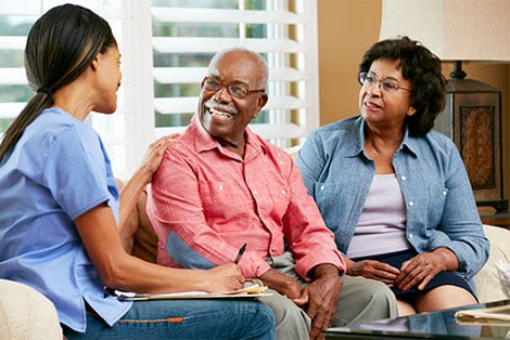 Older couple meet with home health nurse