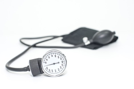 Manual sphygmomanometer device on white background