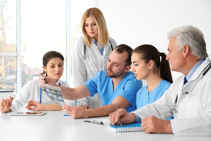 Nurse manager meets with hospital colleagues