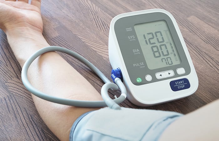 Arm blood pressure monitor on patient