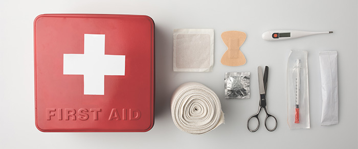 Top view of a first aid kit with emergency supplies