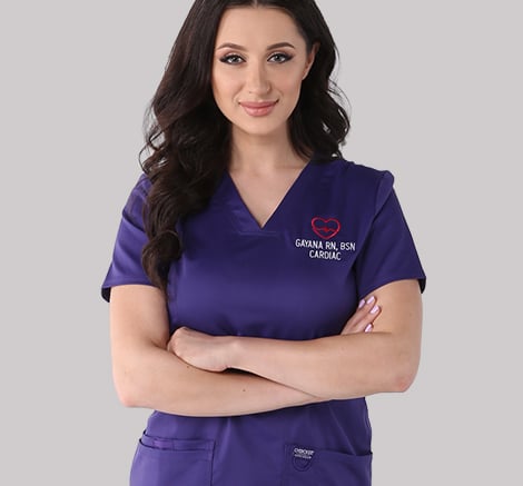Female medical office worker wearing personalized purple scrubs